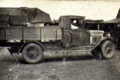 Kirby's farm services lorry in yard.