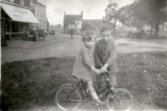 In the background are Trojan cars that were sold by the Francis family c1920.