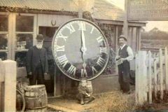 James William Bane, Central Supply Store Advert at the Station.  Clock face is said to be off St Mary's Church. 1906.