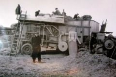 Threshing machine at work during harvest..