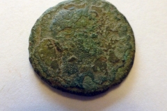 Hadrian copper alloy coin. Reverse shows female standing.