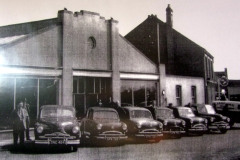 Standard cars outside Kirby's garage on The Green.